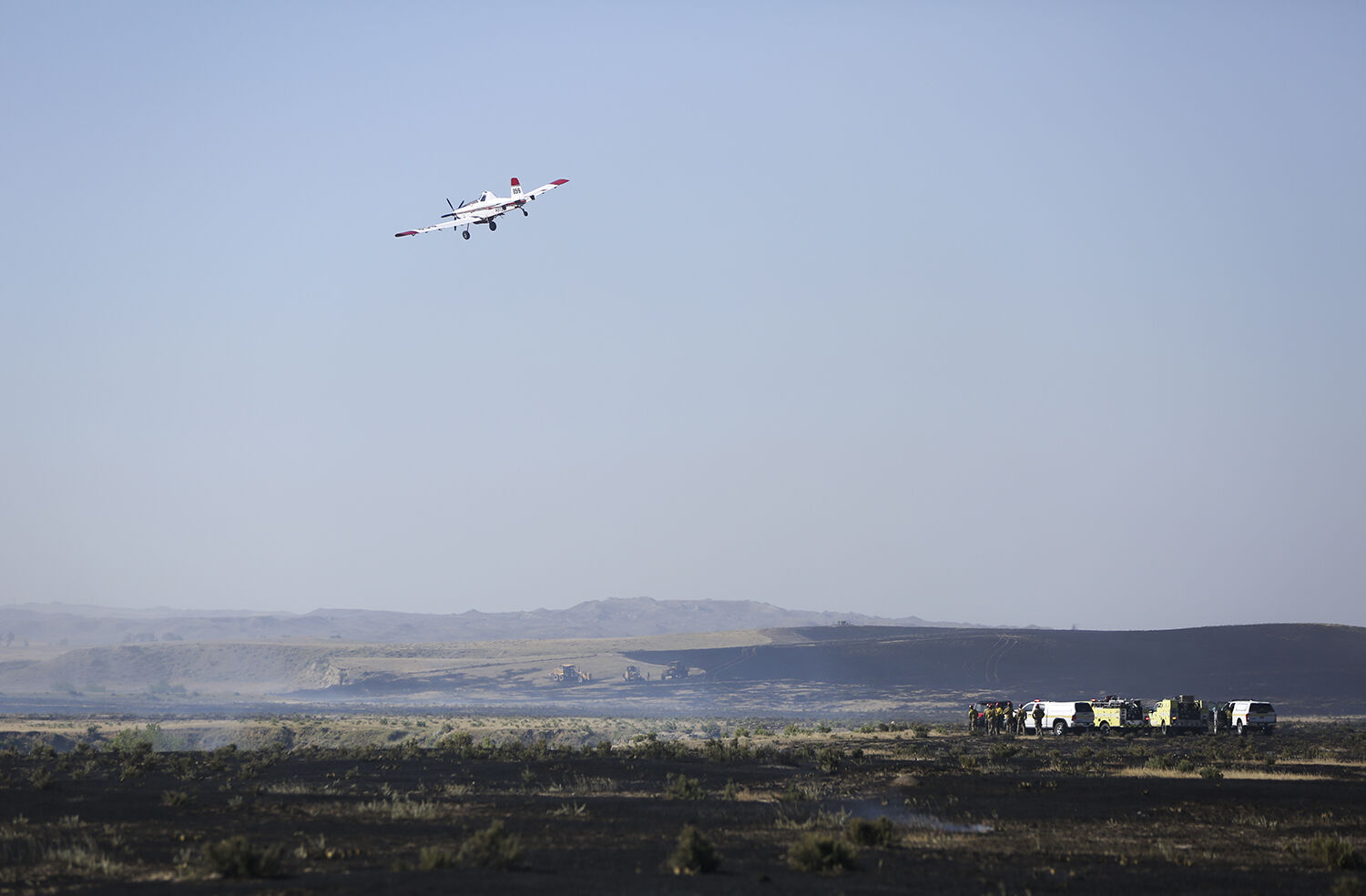 Planes flew overhead of ground crews dropping slurry on the edges of the fire to help slow its spread